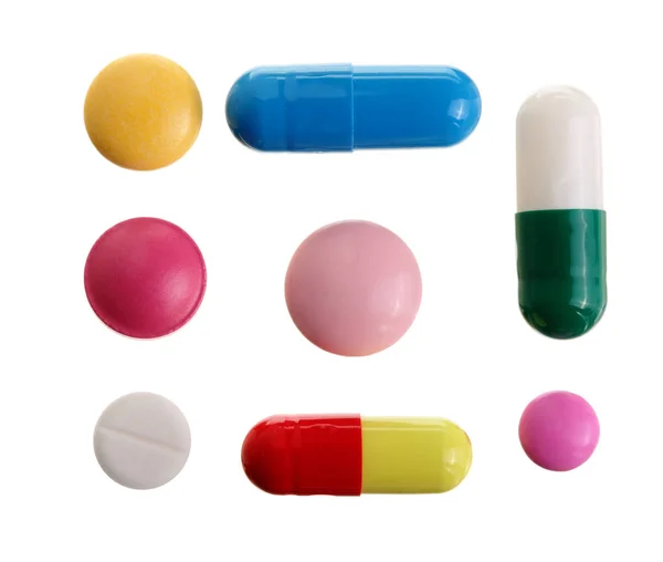 Многоцветная капсула таблетки изолированы на белом фоне. Вид сверху. Плоский лежал. Набор или коллекция — стоковое фото