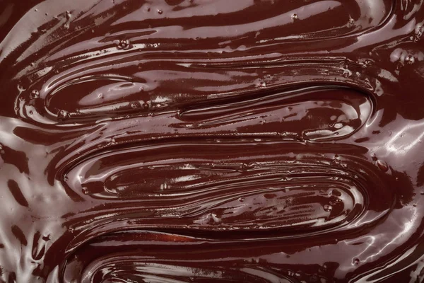 Schmelzschokoladenwirbel als Hintergrund-Nahaufnahme — Stockfoto