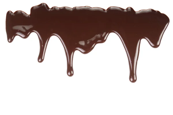 Melted chocolate dripping isolated on white background — Stock Photo, Image