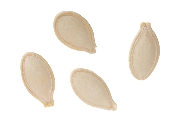 Montón de semillas de calabaza aisladas sobre fondo blanco. Vista superior. Puesta plana — Foto de Stock