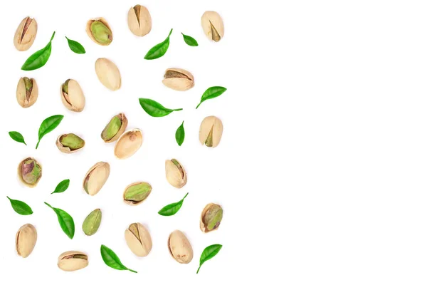 Pistachios decorated with leaves isolated on white background with copy space for your text, top view. Flat lay pattern — Stock Photo, Image