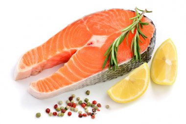 Slice of red fish salmon with lemon, rosemary and peppercorns isolated on white background clipart