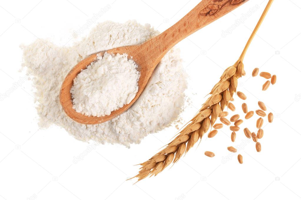 ears of wheat and pile of flour in wooden spoon isolated on white background. Top view. Flat lay