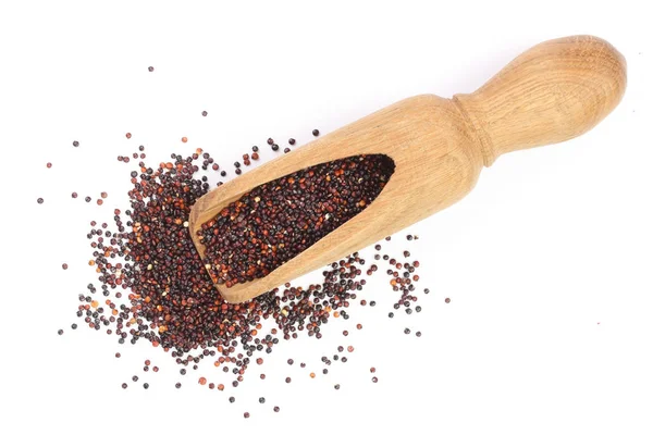 Nasion quinoa czarny w drewniana miarka na białym tle. Widok z góry — Zdjęcie stockowe