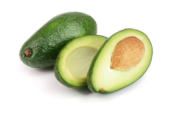 whole and half avocado isolated on white background close-up. Top view