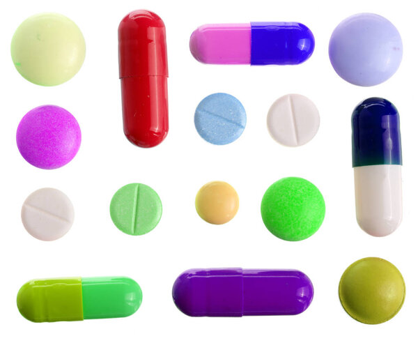 многоцветная капсула таблетки изолированы на белом фоне. Вид сверху. Плоский лежал. Набор или коллекция
