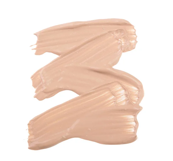 Maquillaje de base líquida beige aislado sobre fondo blanco — Foto de Stock
