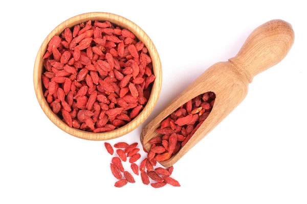 Dried goji berries in wooden bowl and scoop Isolated on white background — Stock Photo, Image