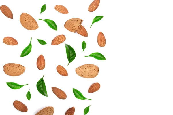 Almonds decorated with leaves isolated on white background with copy space for your text. Top view. Flat lay pattern — Stock Photo, Image