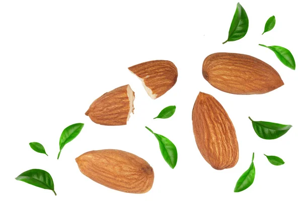 Almonds decorated with leaves isolated on white background with copy space for your text. Top view. Flat lay pattern — Stock Photo, Image