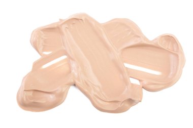 Beyaz arka plan üzerinde izole bej sıvı temel makyaj