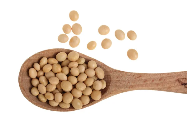 Soybeans in wooden spoon isolated on white background top view — Stock Photo, Image