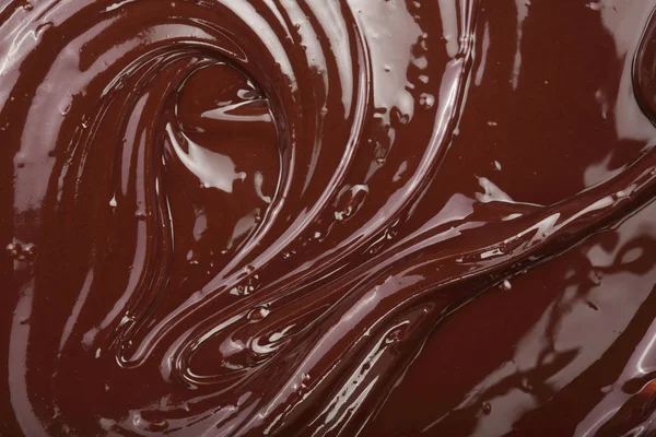 Cioccolato fuso vortice come sfondo primo piano — Foto Stock