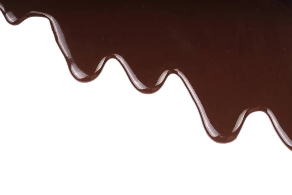 Stopiony czekolada kapiącą na białym tle — Zdjęcie stockowe