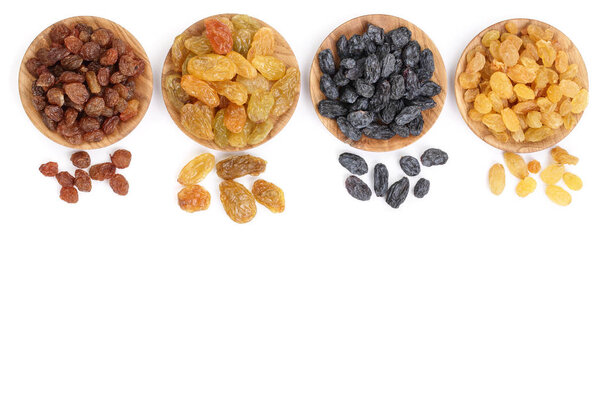 Collection of raisins in wooden bowl isolated on a white background with copy space for your text. Top view. Flat lay