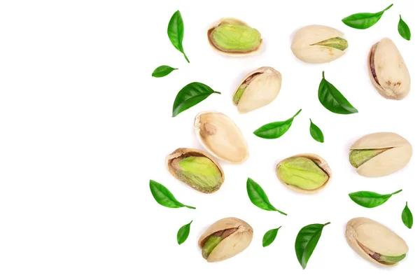 Pistachios with leaves isolated on white background with copy space for your text, top view. Flat lay pattern — Stock Photo, Image