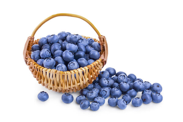 fresh ripe blueberry in a wicker basket isolated on white background