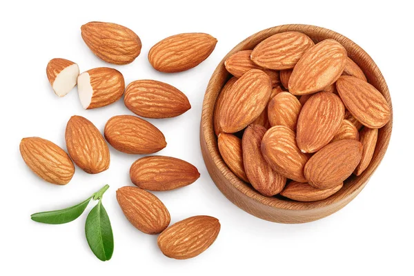 Almonds nuts with leaves in wooden bowl isolated on white background with clipping path and full depth of field. Top view. Flat lay — Stock Photo, Image