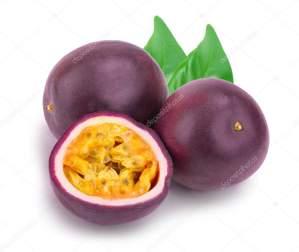Two whole passion fruits with leaves and a half isolated on white background. Isolated maracuya