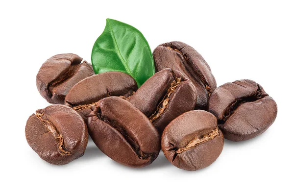 Heap of roasted coffee beans with leaves isolated on white background with clipping path and full depth of field. — Stock Photo, Image