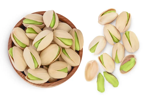 Pistachio in wooden bowl isolated on white background with clipping path and full depth of field. Top view. Flat lay — Stock Photo, Image