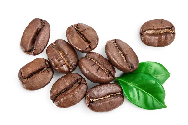 Heap of roasted coffee beans with leaves isolated on white background with clipping path and full depth of field . Top view. Flat lay. — Stock Photo, Image