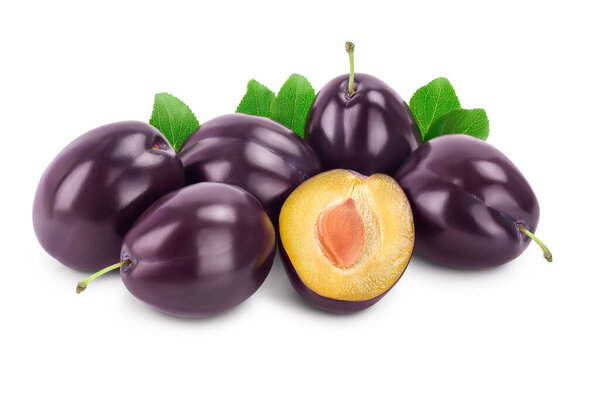fresh purple plum and half with leaves isolated on white background with clipping path and full depth of field