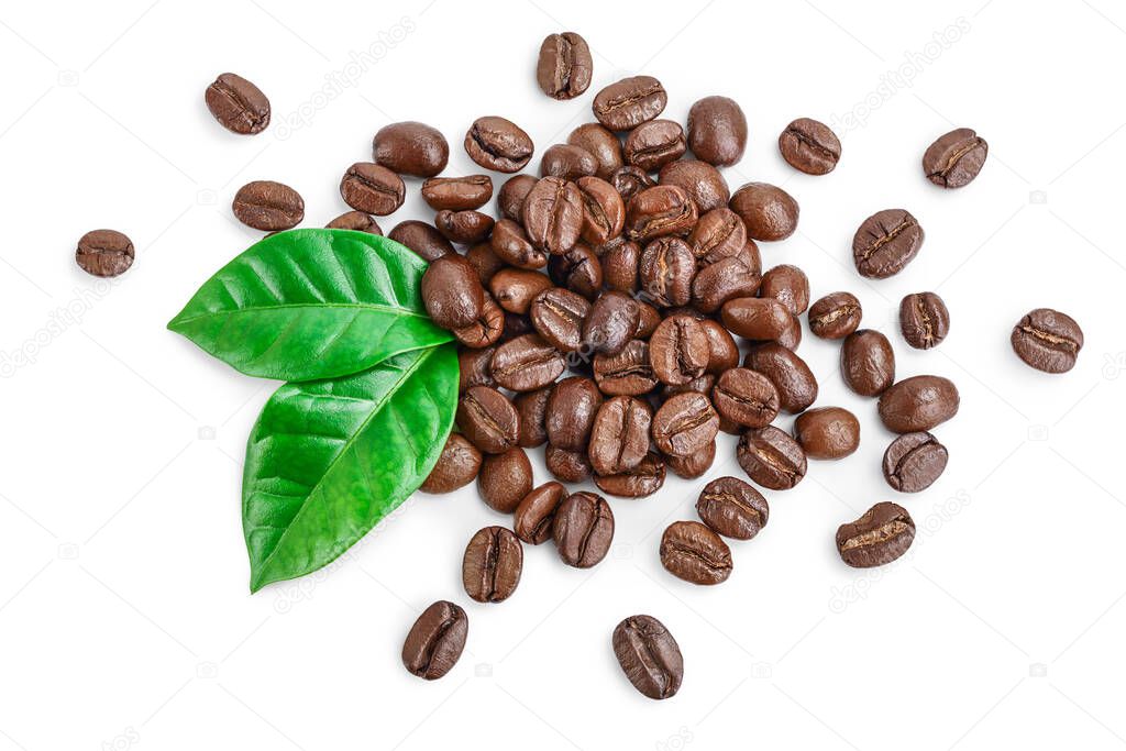 Heap of roasted coffee beans with leaves isolated on white background . Top view. Flat lay.