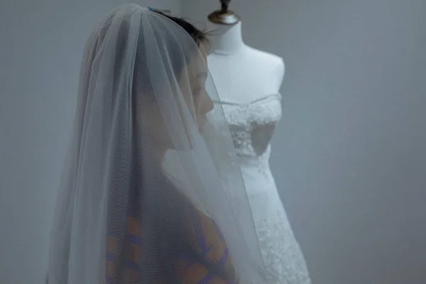 wedding dress on mannequin in the room