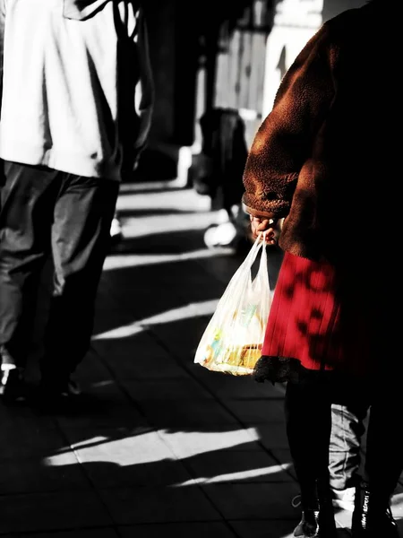 man with a bag of coffee and a paper bags