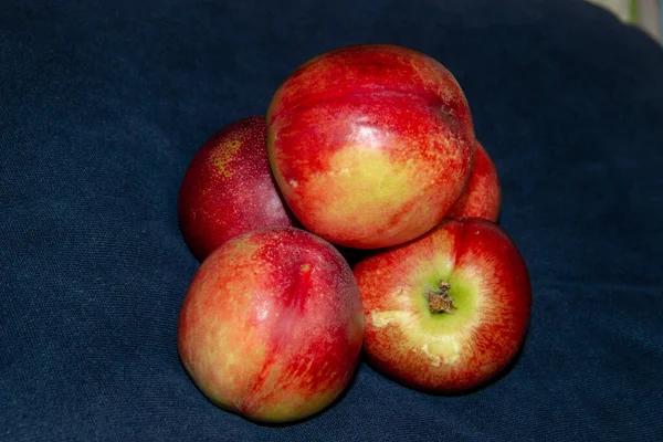 red and green apples on a black background