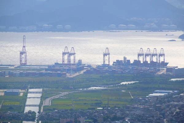 industrial landscape with cranes and river