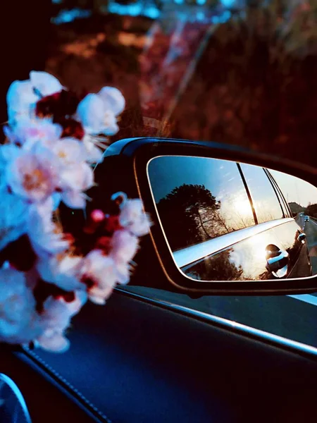 vintage car with red roses