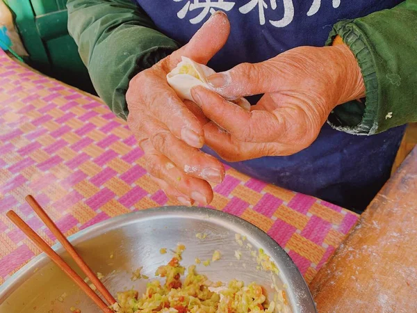 a man is cooking a dish of food
