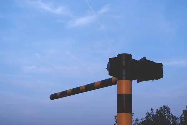 a low angle view of a road lamp against a blue sky