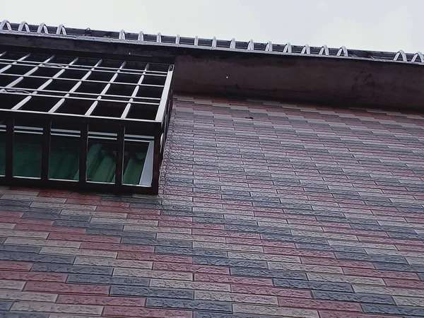 modern building with a roof and a window