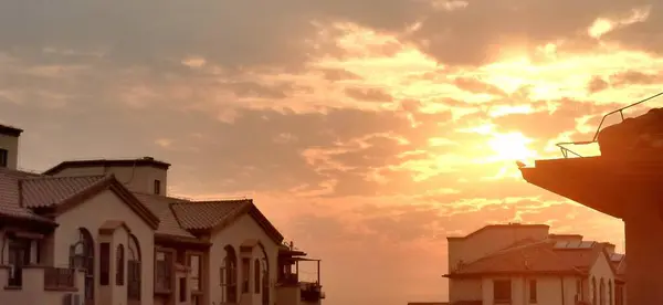 stock image sunset over the city of the town