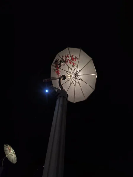 stock image street lamp with a star and a black background