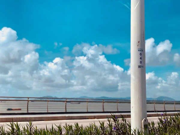 empty road with blue sky and clouds