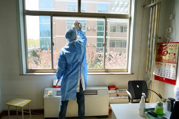 worker in protective mask and gloves working in the hospital