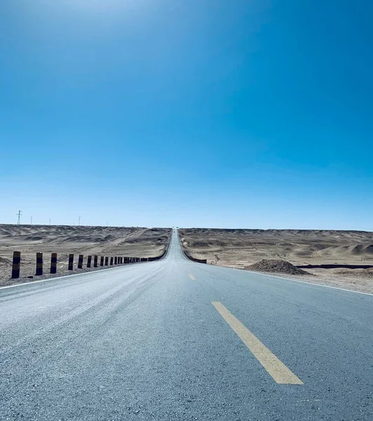 empty asphalt road in the desert