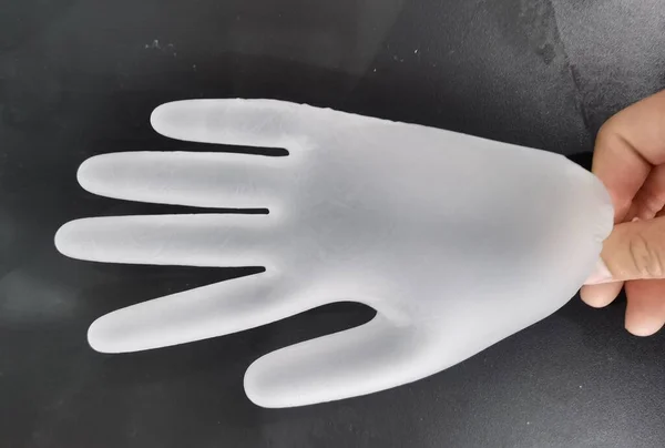 black and white hand wash gloves on a gray background