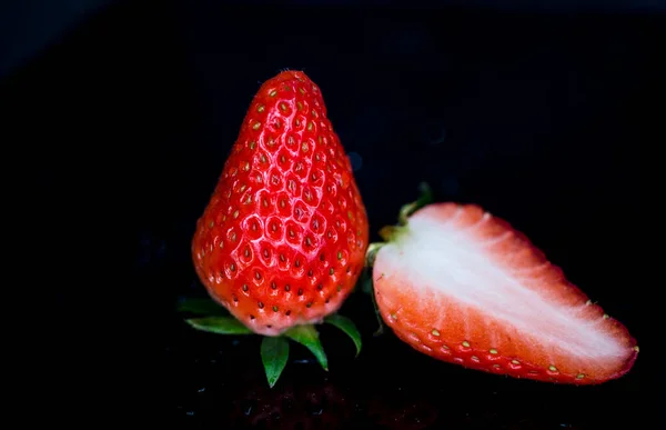 fresh strawberries on a black background