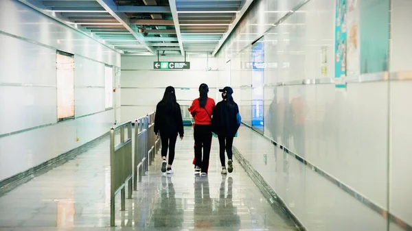 people walking in the subway station