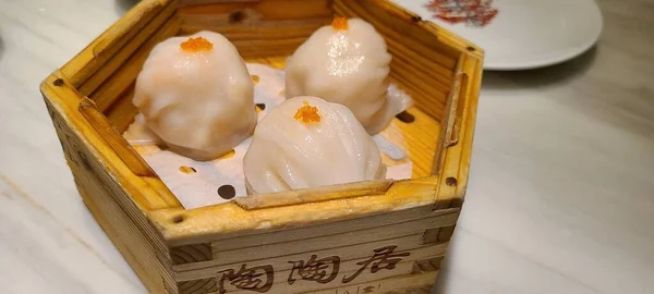 chinese steamed dumpling with sauce and egg