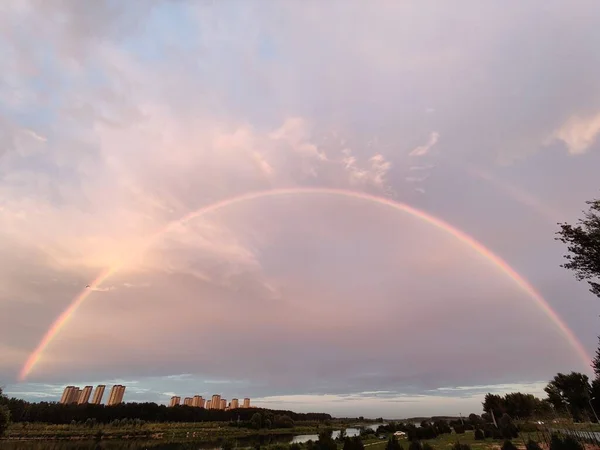 rainbow sky with clouds and blue skies