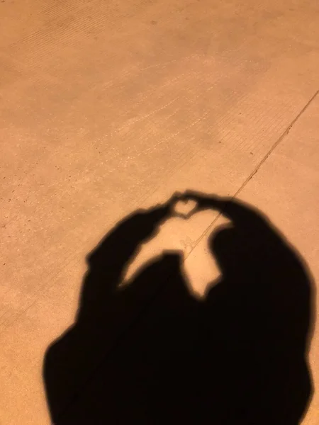 silhouette of a man with a heart on the beach