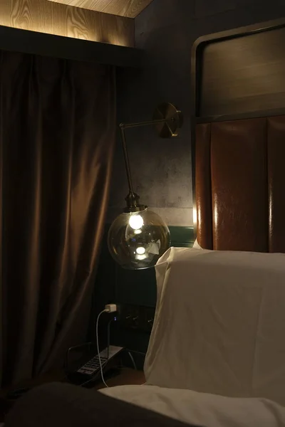 interior of a hotel room with a lamp