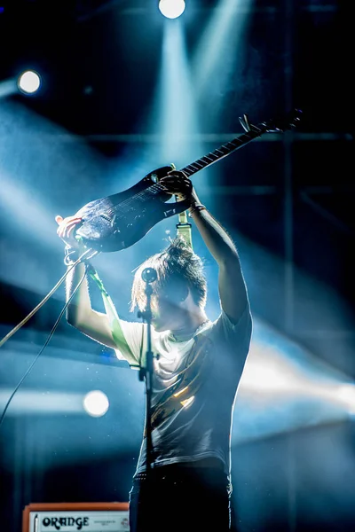 young man with a tattoo on the stage