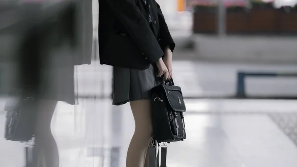 business woman with bag of black and white